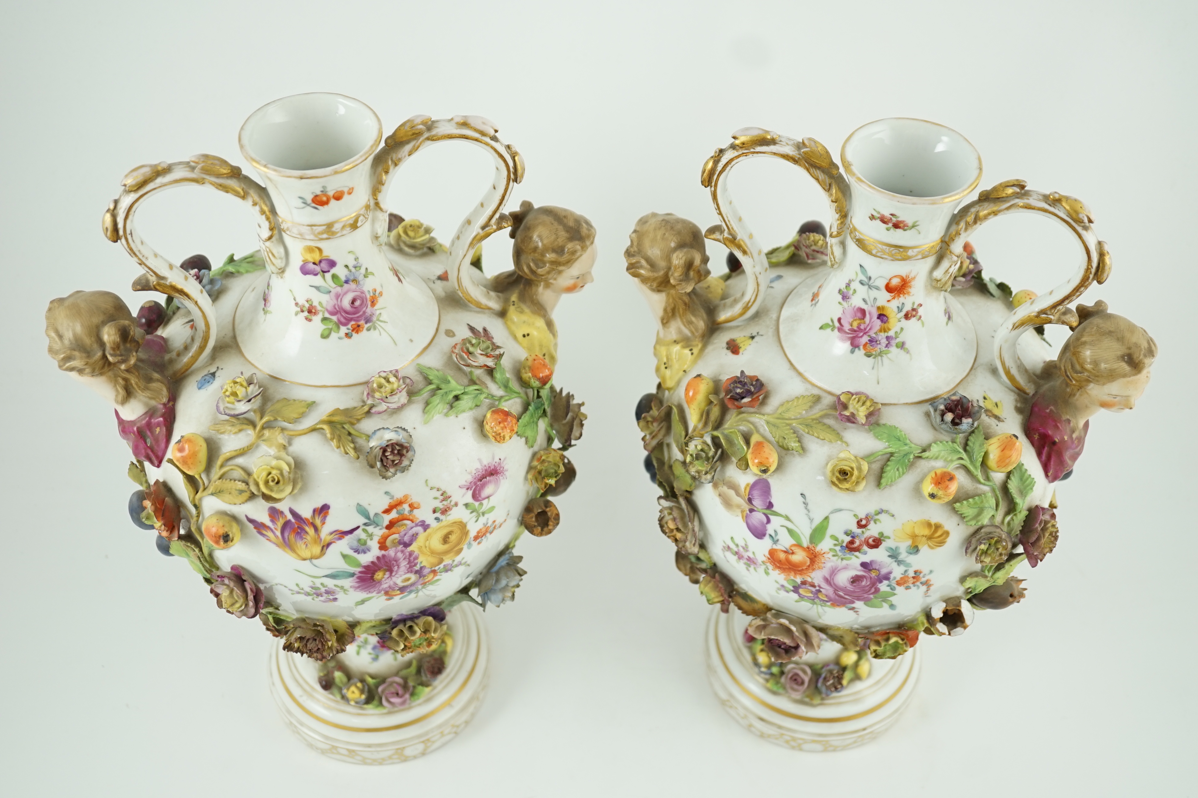 A pair of Potschappel porcelain vases and cover, late 19th century, 41cm high, slight damage